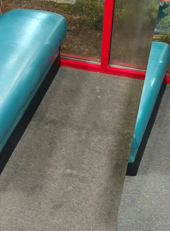 Before: restaurant carpet by the booths, gray with ground-in dirt.
