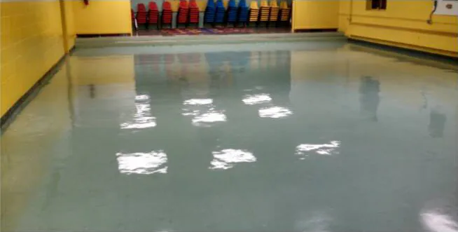 After: the same floor clean and glossy, reflecting the lights.
