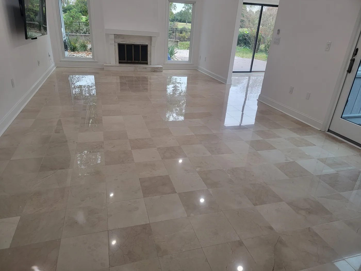 A polished marble floor in a bright living room.