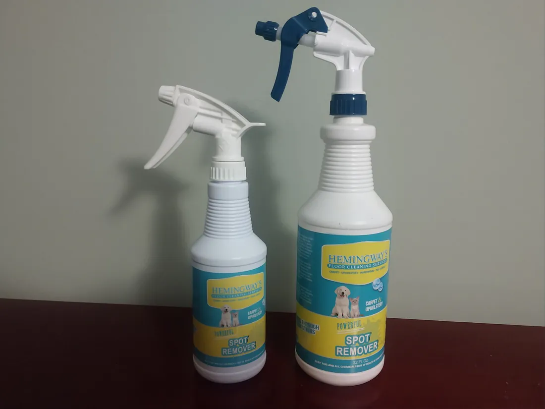 Two bottles of Hemingway's own products: the floor stain and spot remover and the hardwood floor cleaner.